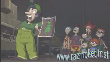 Tommy's father Stu holding up the blueprint of the theme park's Reptar robot